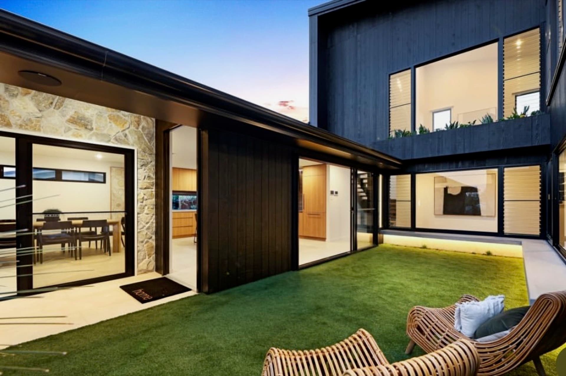 Contemporary Melbourne home exterior painted by Two Bros at dusk